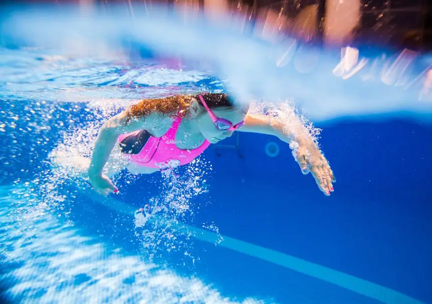 Young girl competitively swimming in Central Massachusetts.