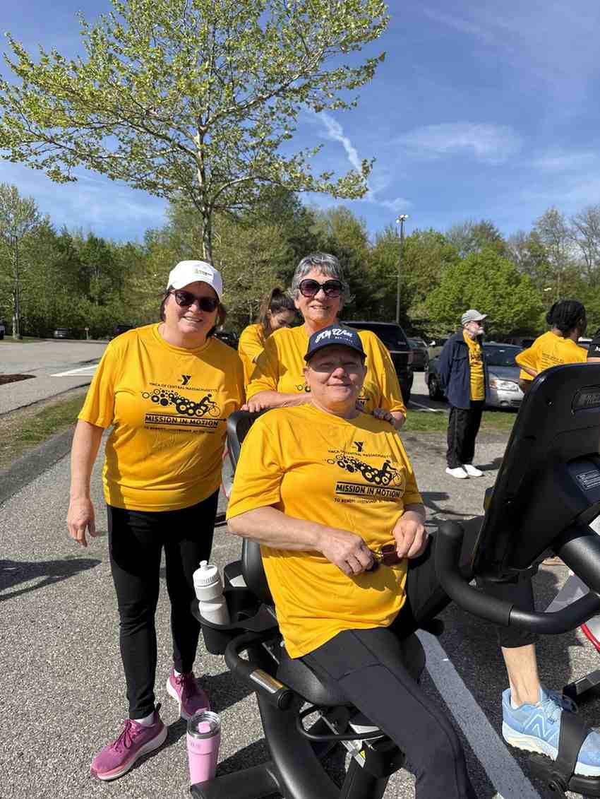 YMCA Mission in Motion participants wearing yellow shirts during the community cycling fundraiser